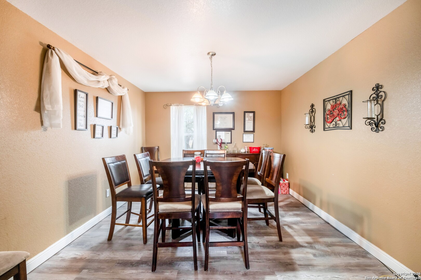 1655 Eichman Road Poteet, TX 78065 - Photo 8 of 45 a view of a dining room with furniture and chandelier