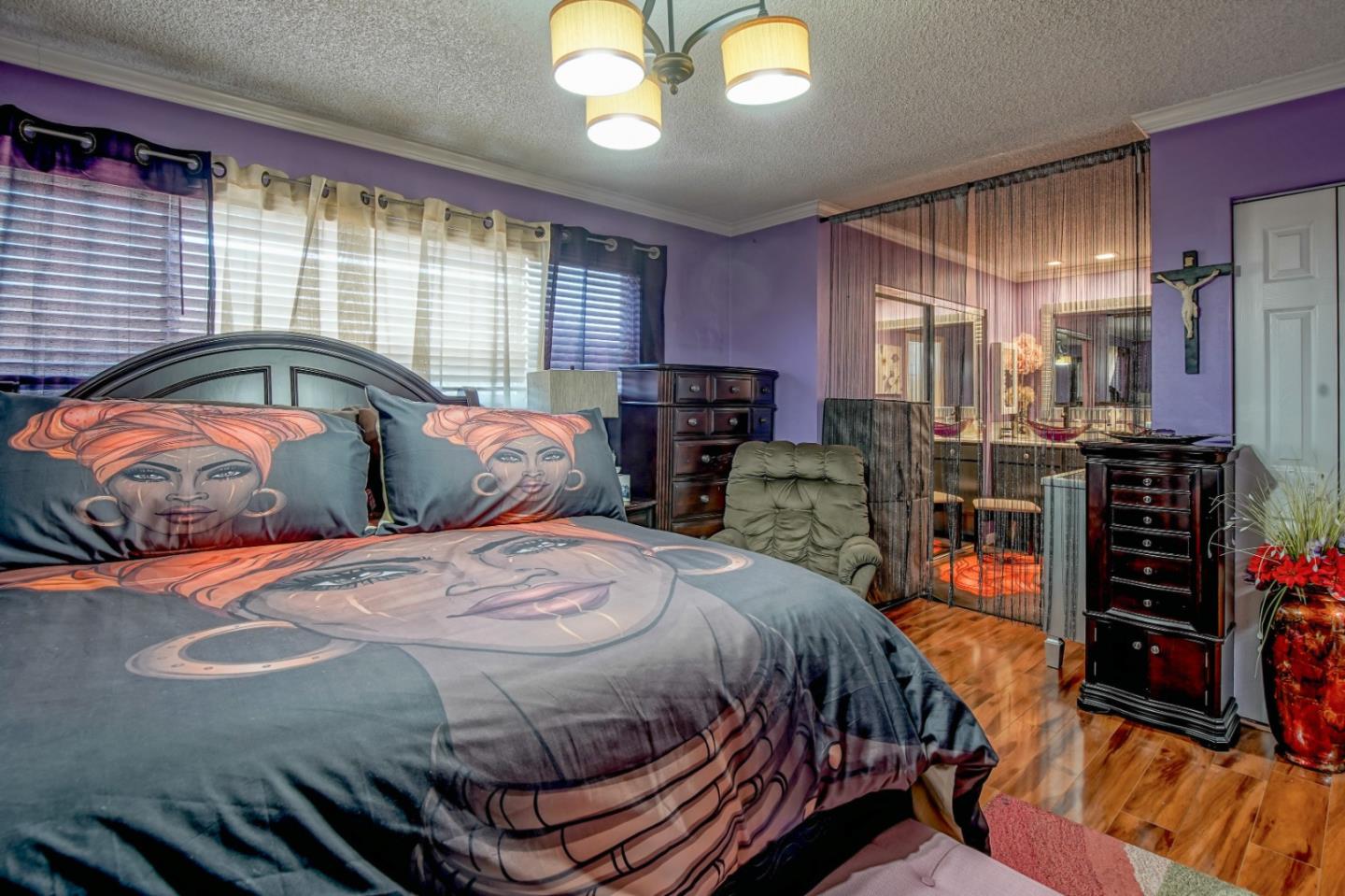 3106 Bradley Circle Marina, CA 93933 - Photo 9 of 16 a bedroom with bed and wooden floor