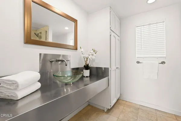 a view of a bathroom from a hallway