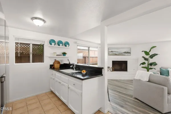 a kitchen with a sink and cabinets