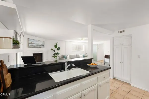 a kitchen with stainless steel appliances a refrigerator sink and stove