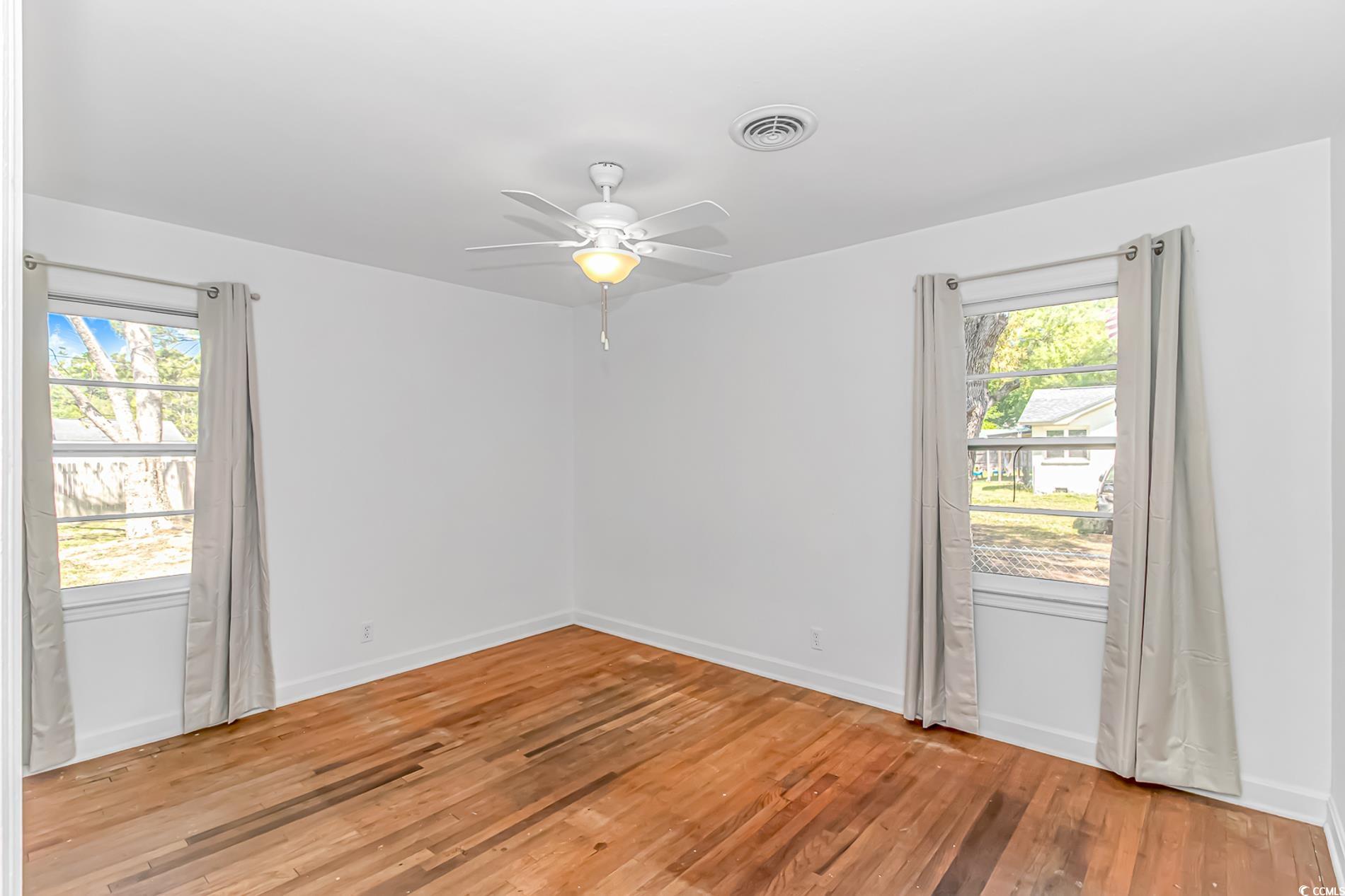 1931 Jasper Street Georgetown, SC 29440 - Photo 16 of 30 Empty room featuring visible vents, ceiling fan, a