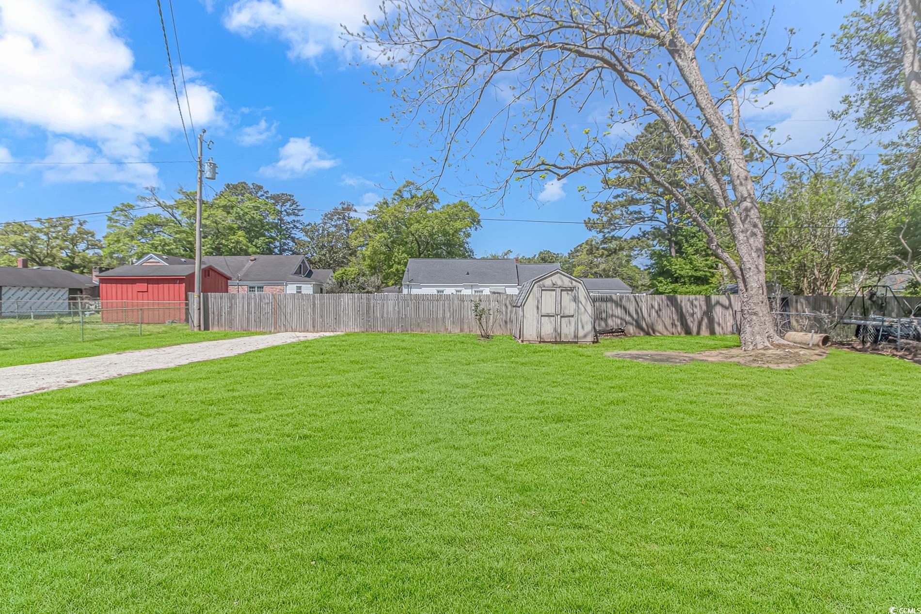 1931 Jasper Street Georgetown, SC 29440 - Photo 29 of 30 View of yard featuring an outdoor structure, a she
