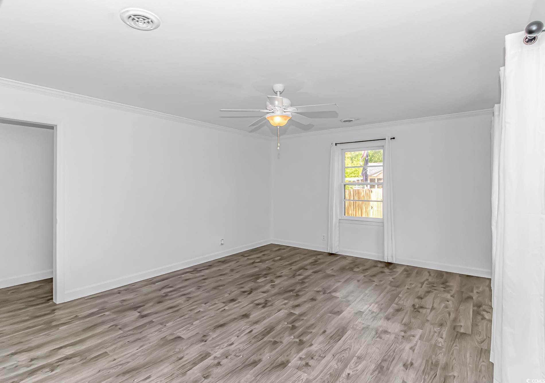1931 Jasper Street Georgetown, SC 29440 - Photo 7 of 30 Unfurnished room featuring wood finished floors, o