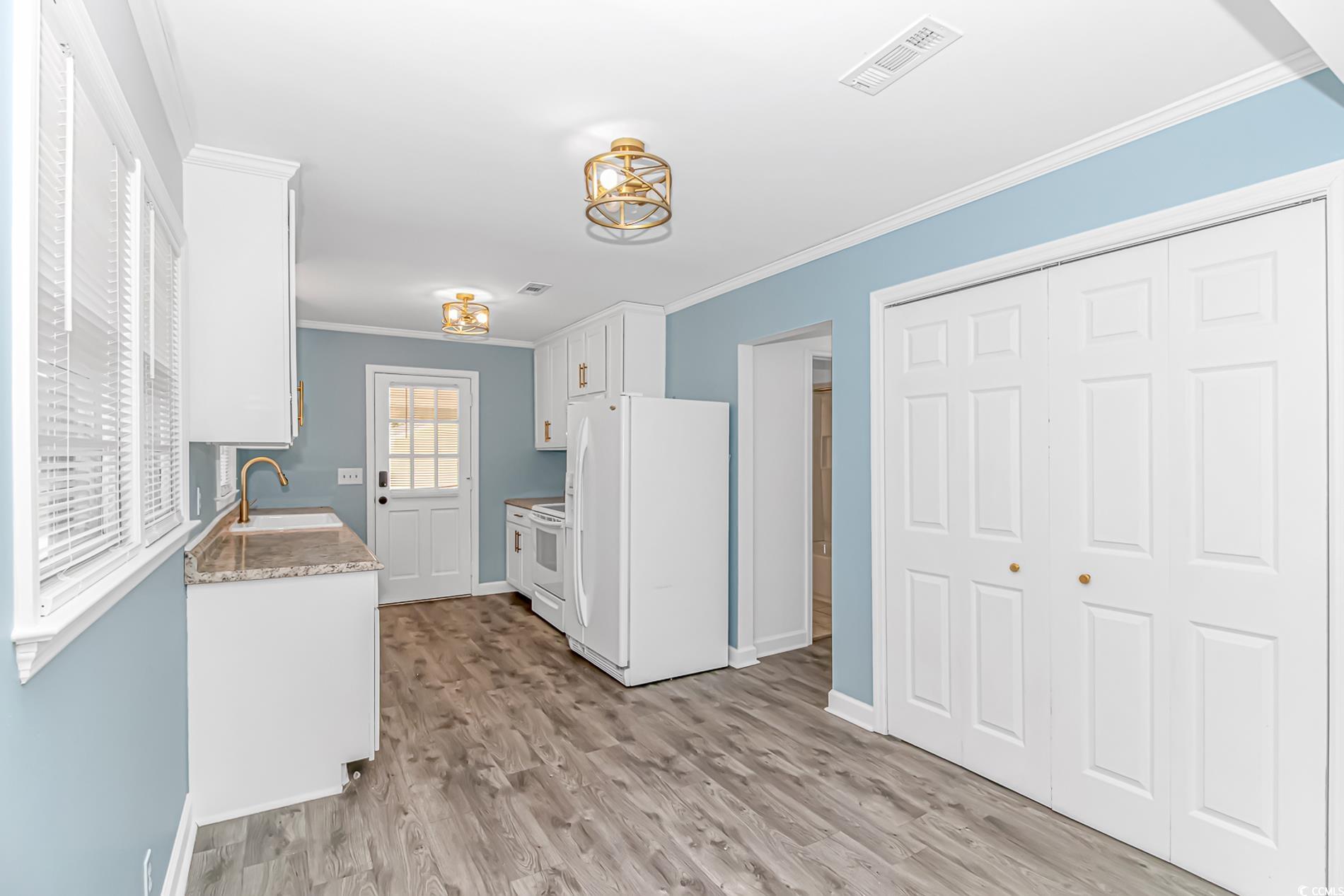 1931 Jasper Street Georgetown, SC 29440 - Photo 9 of 30 Kitchen featuring white appliances, visible vents,