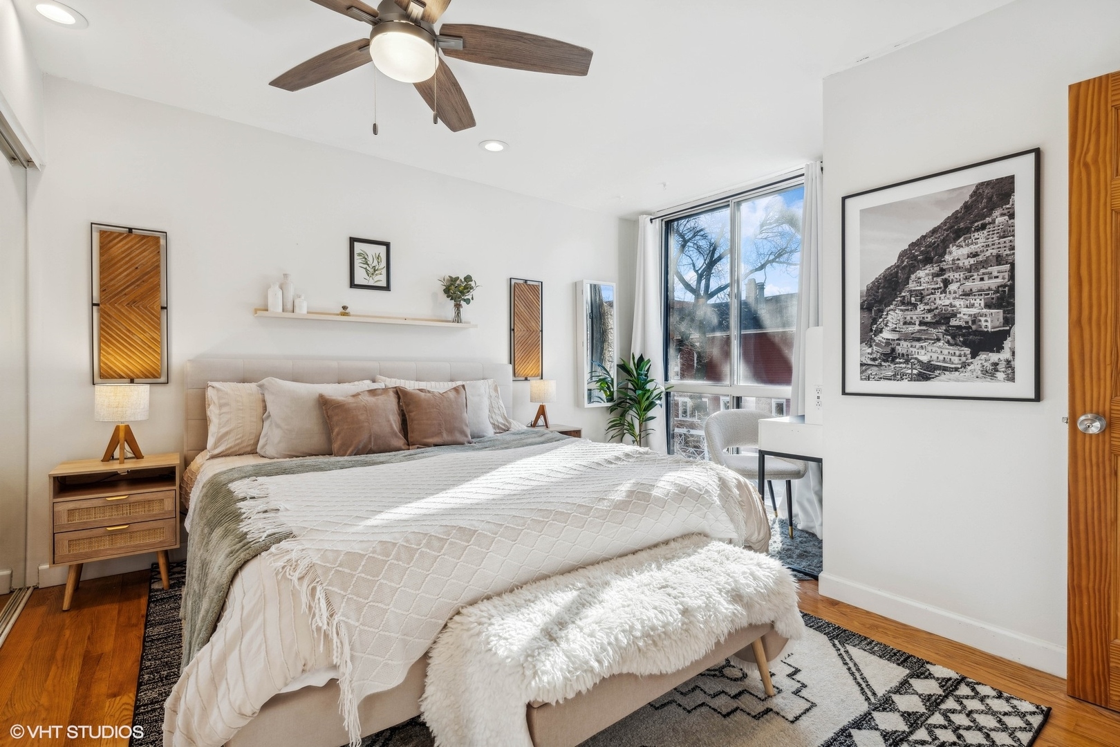 2701 North Racine Avenue, Unit A Chicago, IL 60614 - Photo 16 of 25 a bedroom with a bed and a painting on the wall