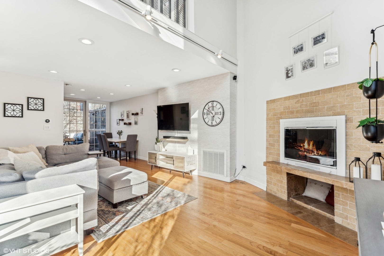 2701 North Racine Avenue, Unit A Chicago, IL 60614 - Photo 2 of 25 a living room with furniture a flat screen tv and a fireplace