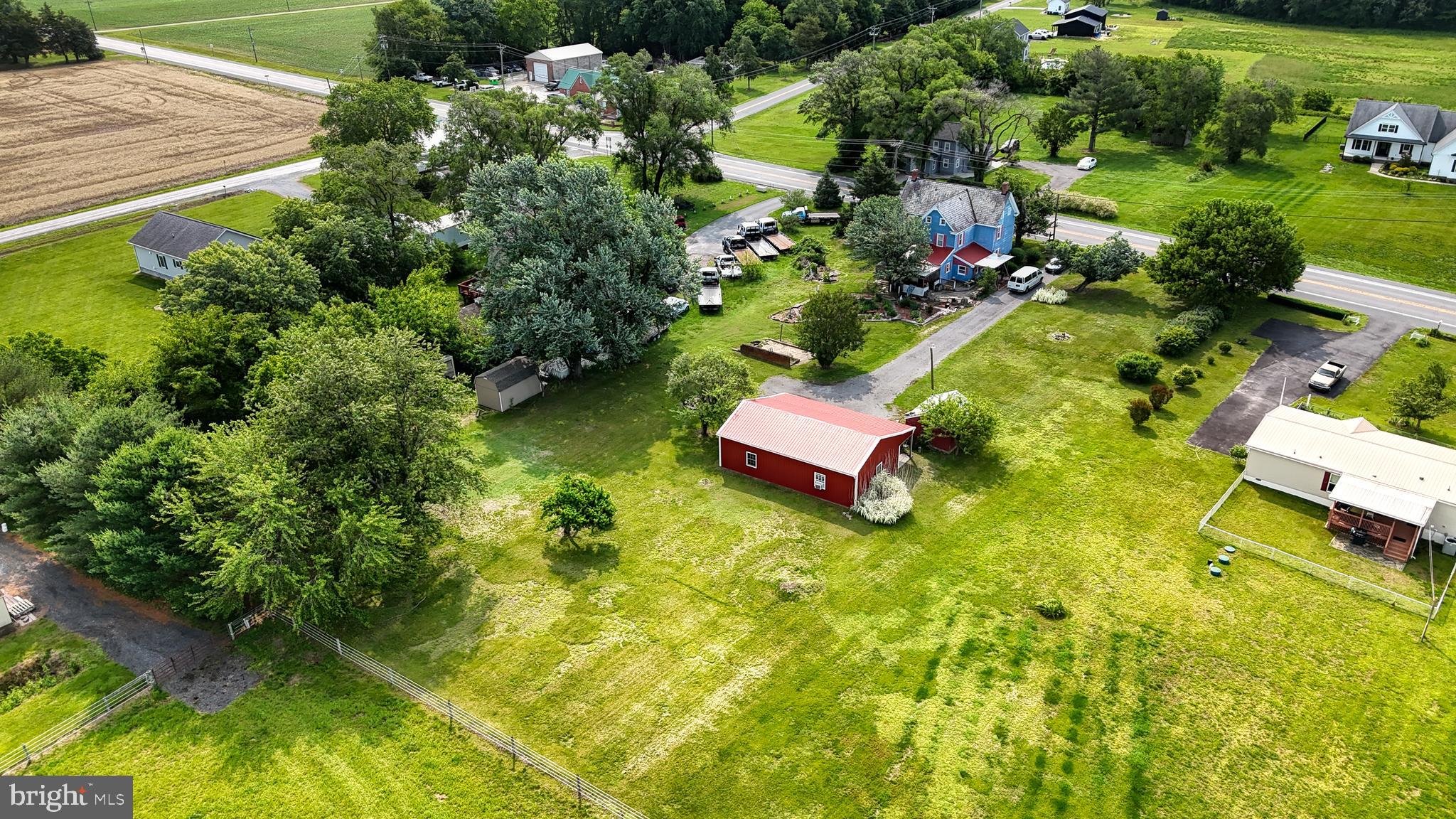 5403 Willow Grove Road Camden Wyoming, DE 19934 - Photo 25 of 42 an aerial view of a house with swimming pool and green space