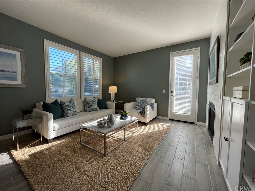 21 Thorp Ladera Ranch Ladera Ranch, CA 92694 - Photo 3 of 15 a living room with furniture and a fireplace