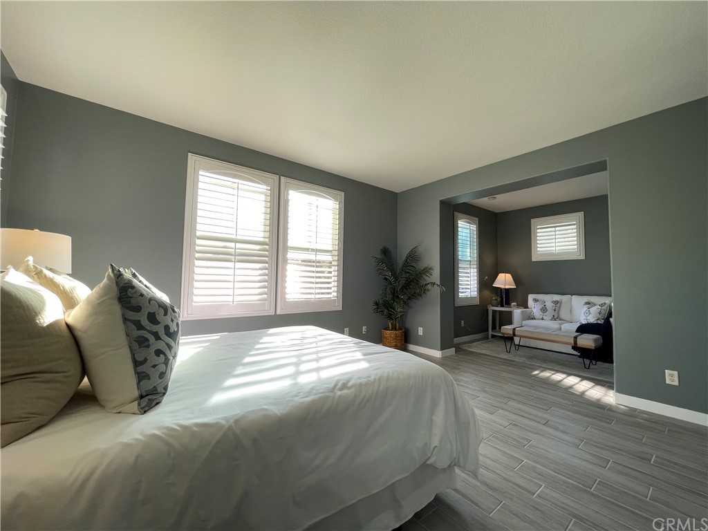 21 Thorp Ladera Ranch Ladera Ranch, CA 92694 - Photo 6 of 15 a spacious bedroom with a bed and a couch