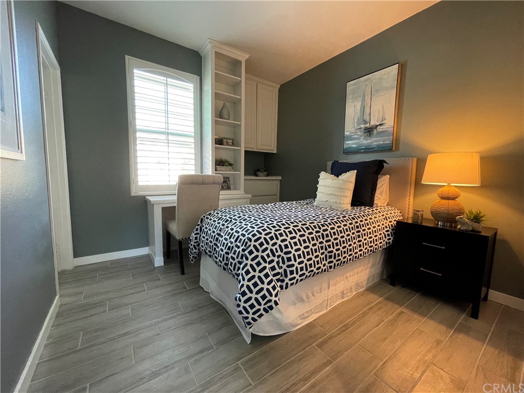 21 Thorp Ladera Ranch Ladera Ranch, CA 92694 - Photo 8 of 15 a bedroom with a bed and window