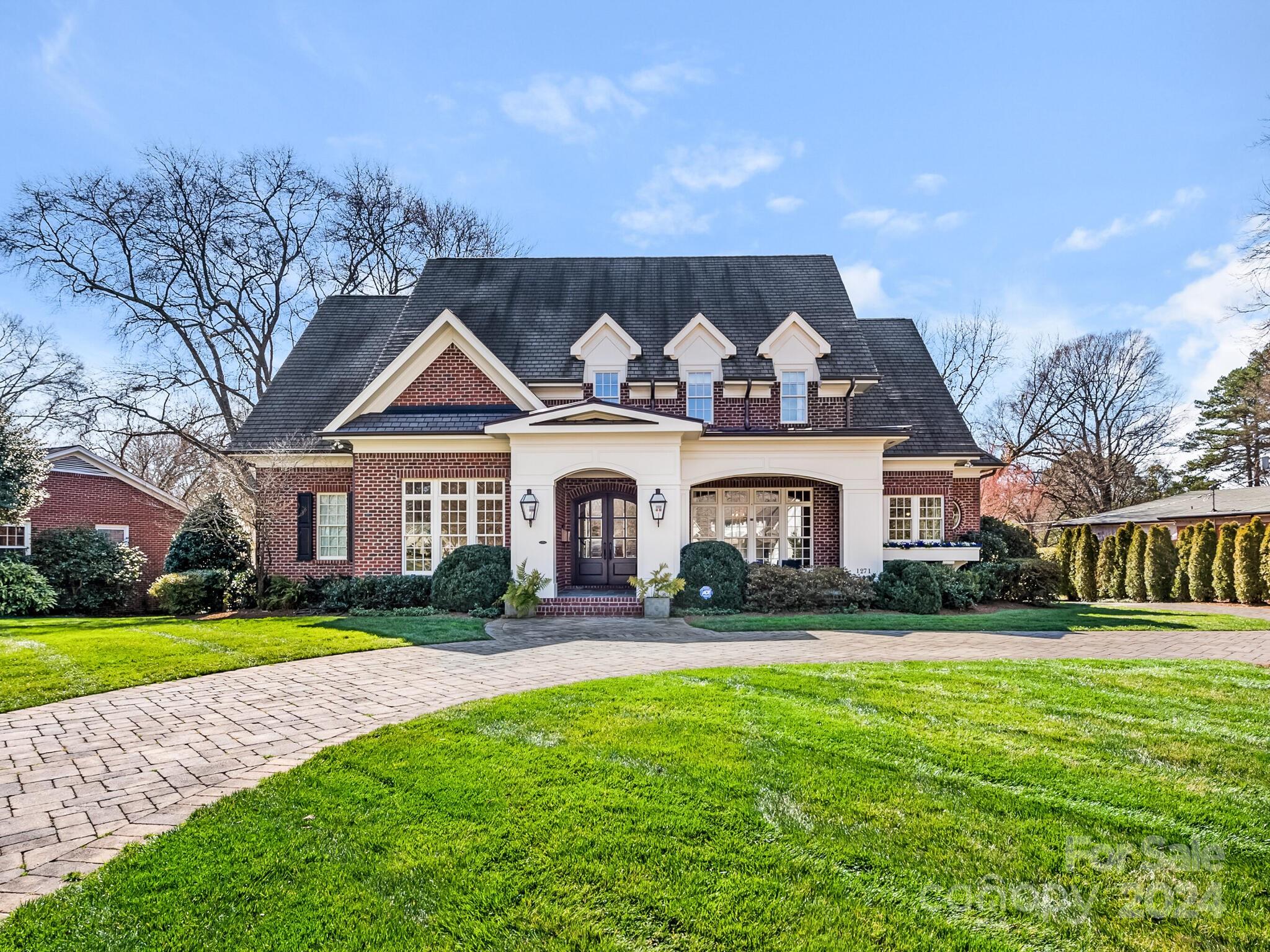 1271 Andover Road Charlotte, NC 28211 - Photo 1 of 40 a front view of a house with a yard