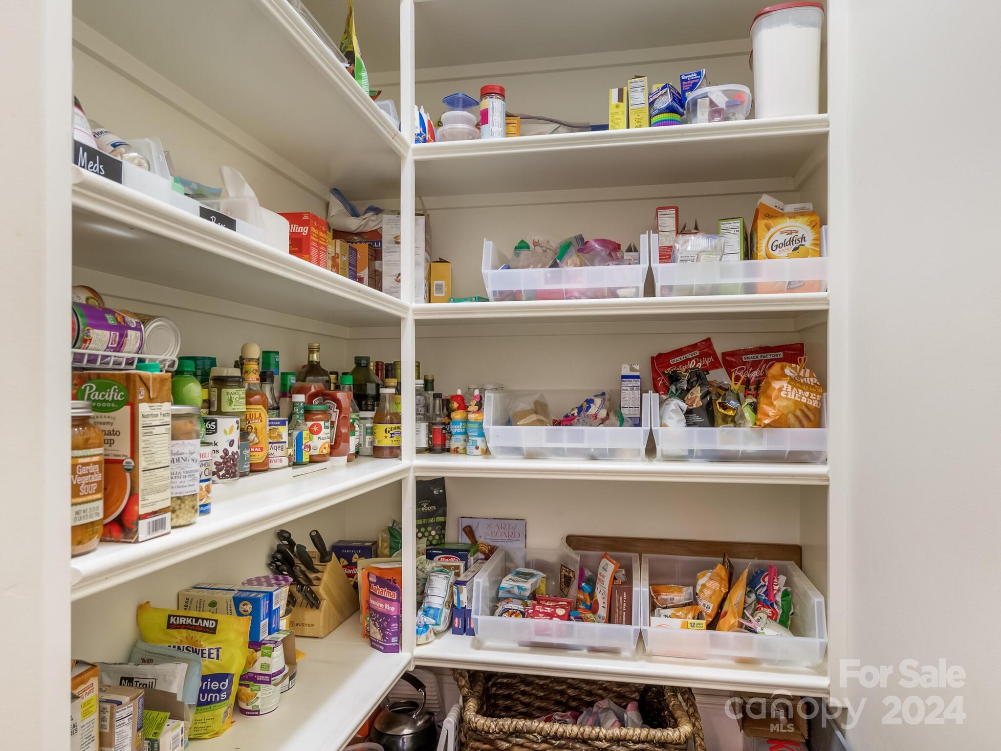 1271 Andover Road Charlotte, NC 28211 - Photo 15 of 40 a store room with lots of clutter and refrigerator