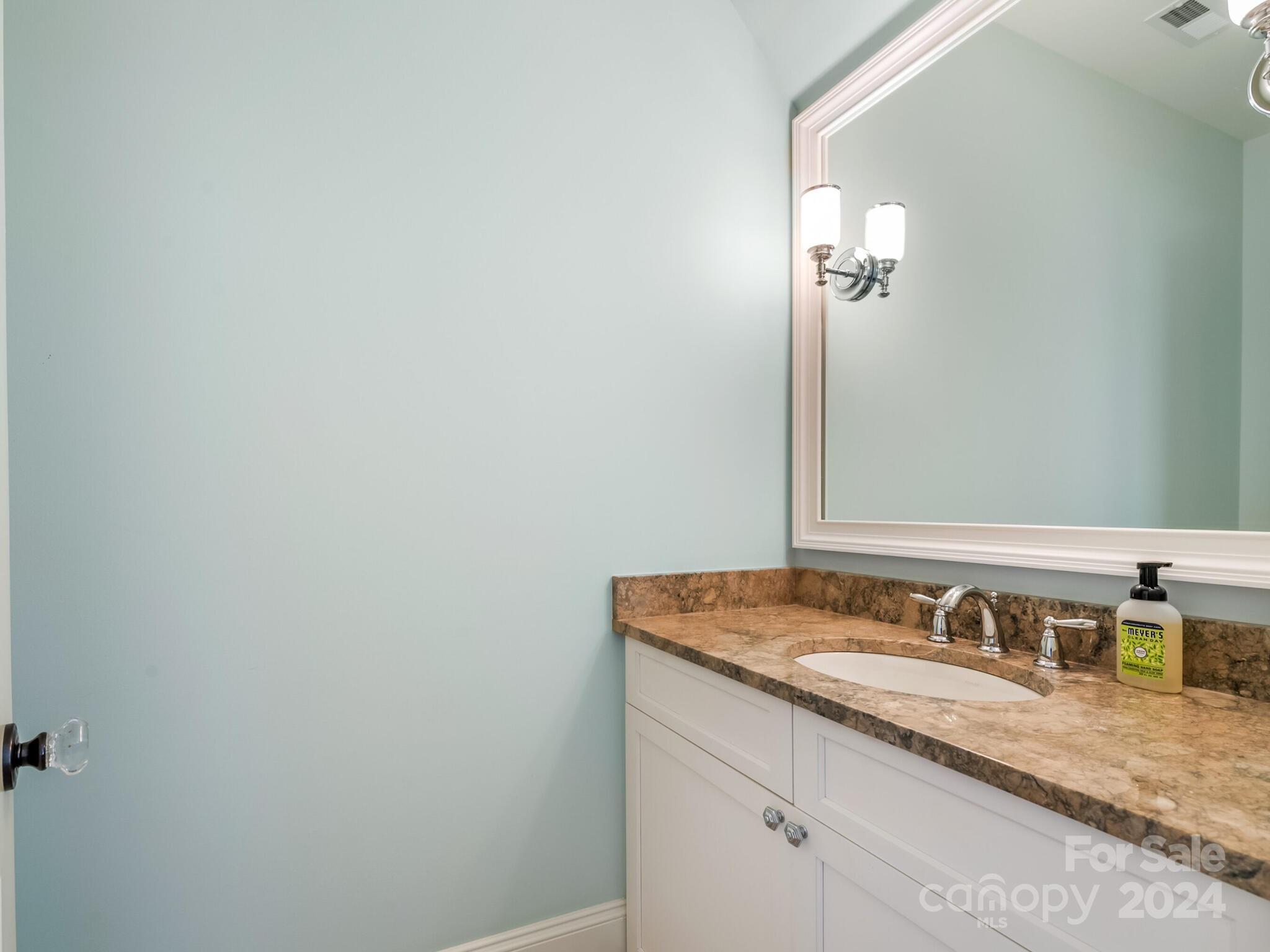 1271 Andover Road Charlotte, NC 28211 - Photo 26 of 40 a bathroom with a granite countertop sink and a mirror