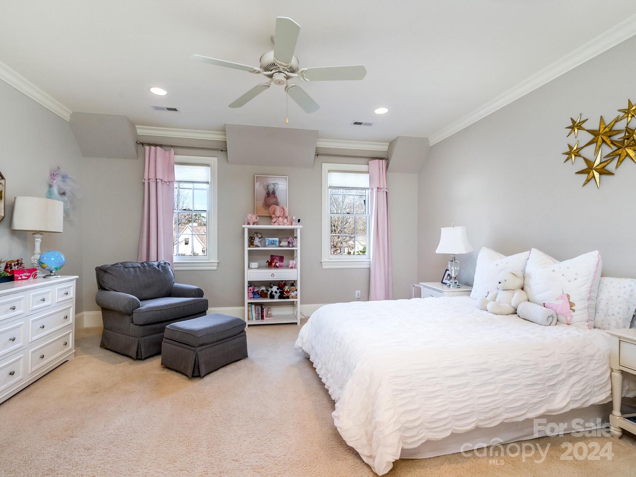 1271 Andover Road Charlotte, NC 28211 - Photo 27 of 40 a spacious bedroom with a bed and a couch