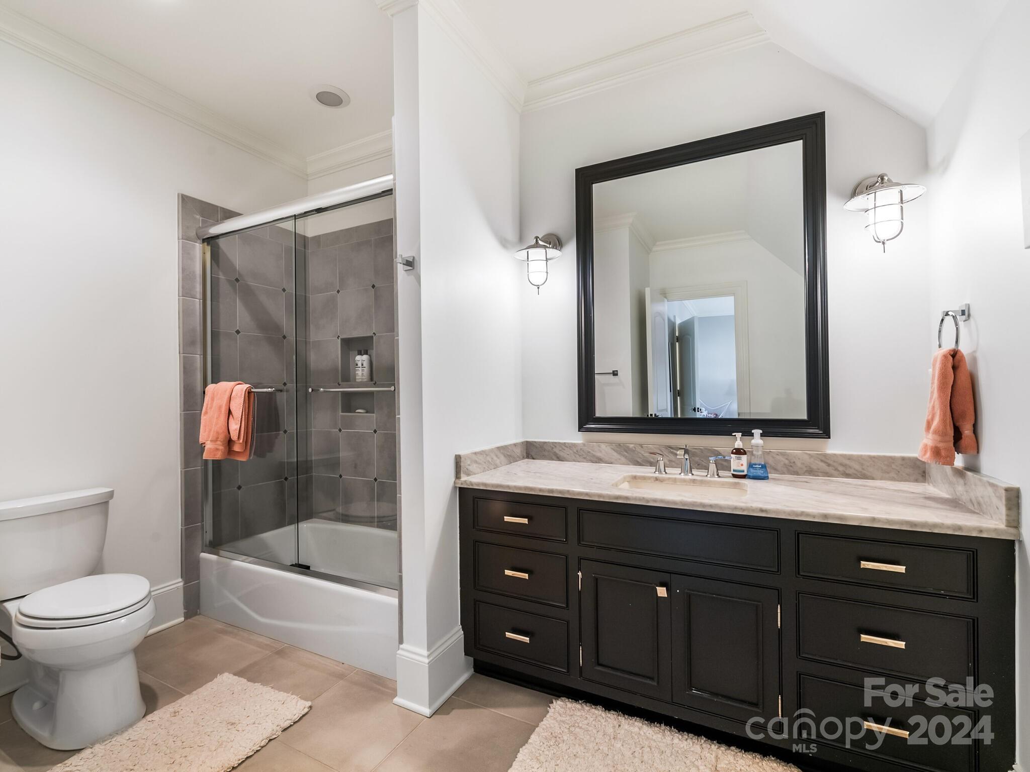 1271 Andover Road Charlotte, NC 28211 - Photo 28 of 40 a bathroom with a toilet a sink and bathtub