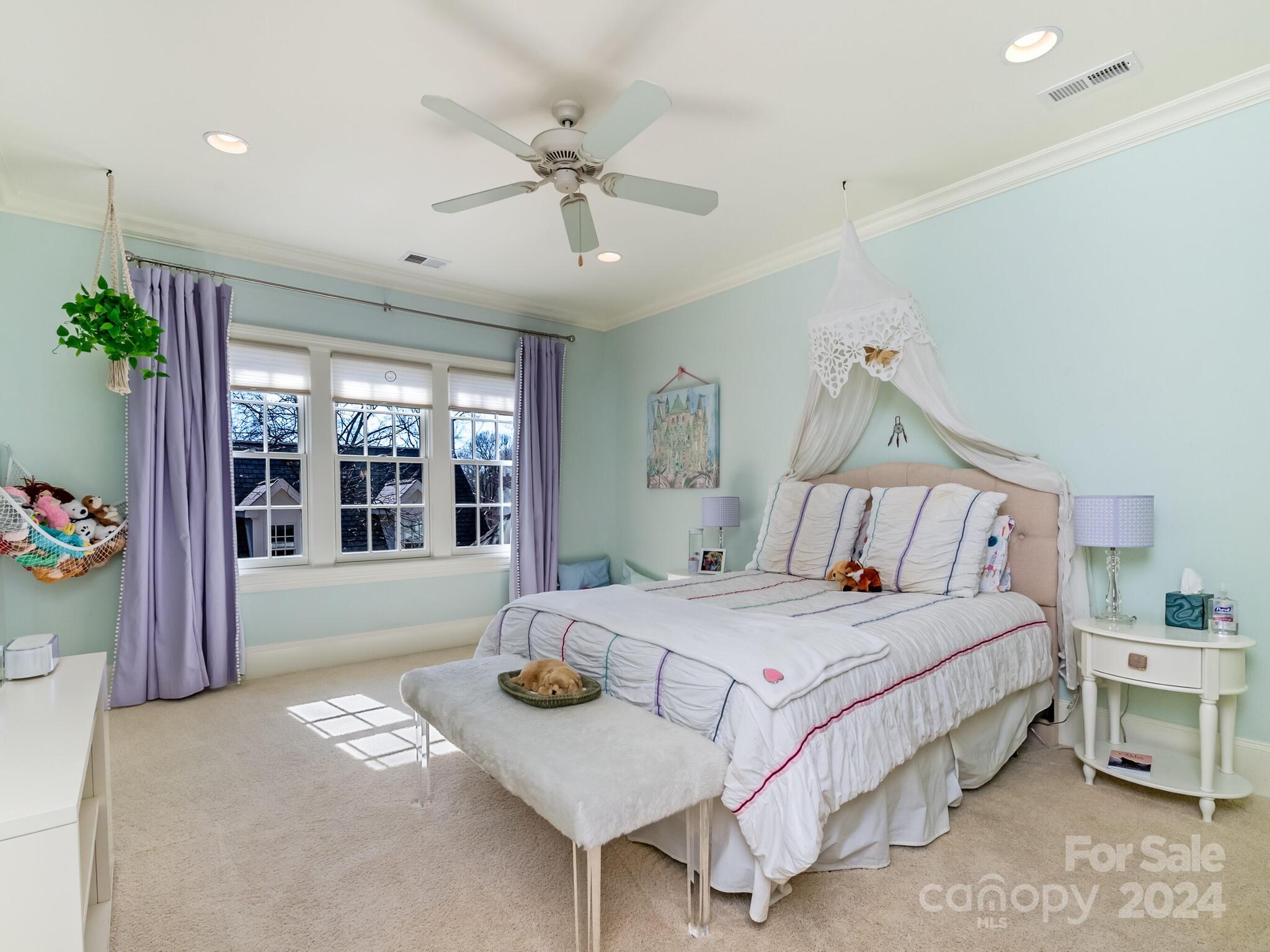 1271 Andover Road Charlotte, NC 28211 - Photo 29 of 40 a bedroom with a bed and ceiling fan