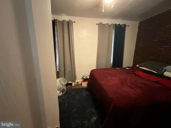 a bed room with a bed and a mirror