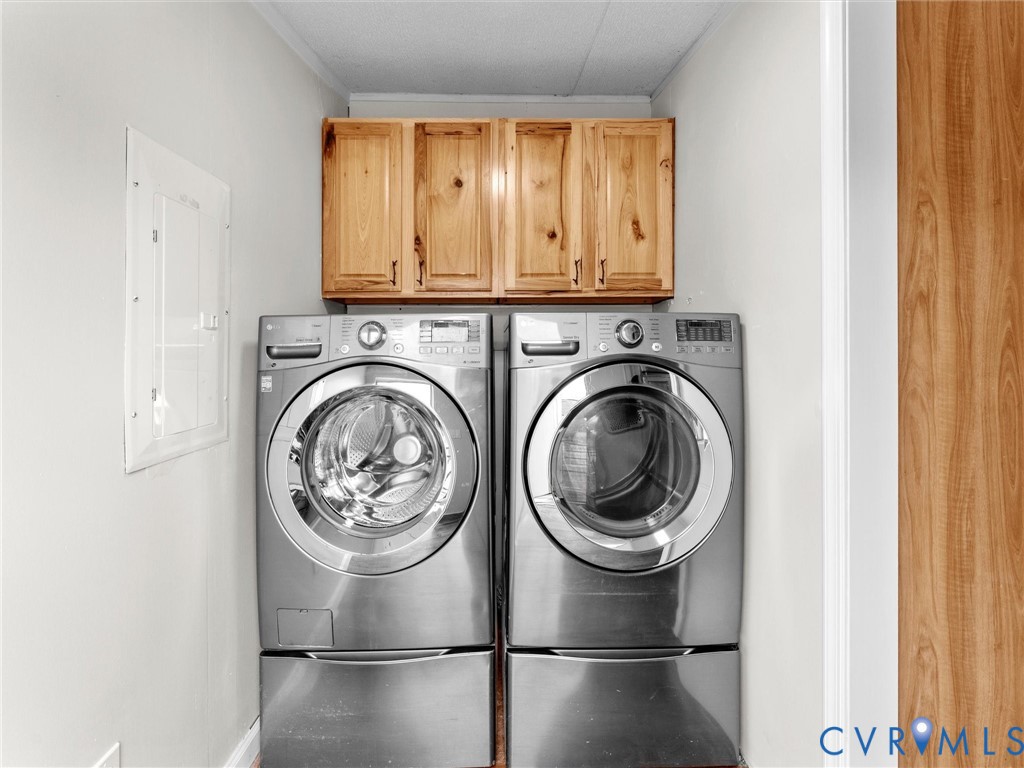 4772 Carsley Road Waverly, VA 23890 - Photo 12 of 38 a view of a hallway with washer and dryer