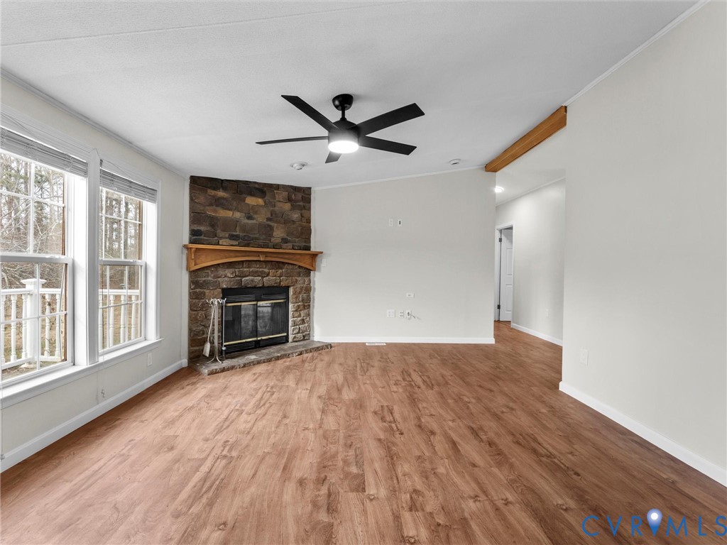 4772 Carsley Road Waverly, VA 23890 - Photo 2 of 38 a view of empty room with wooden floor and ceiling fan