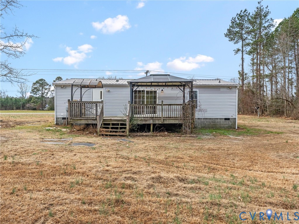 4772 Carsley Road Waverly, VA 23890 - Photo 34 of 38 a view of a house with backyard and tree