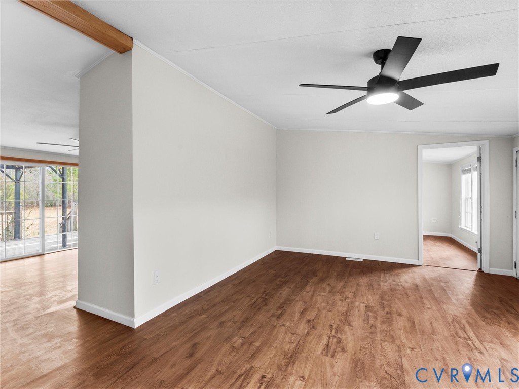 4772 Carsley Road Waverly, VA 23890 - Photo 4 of 38 a view of empty room with wooden floor and fan