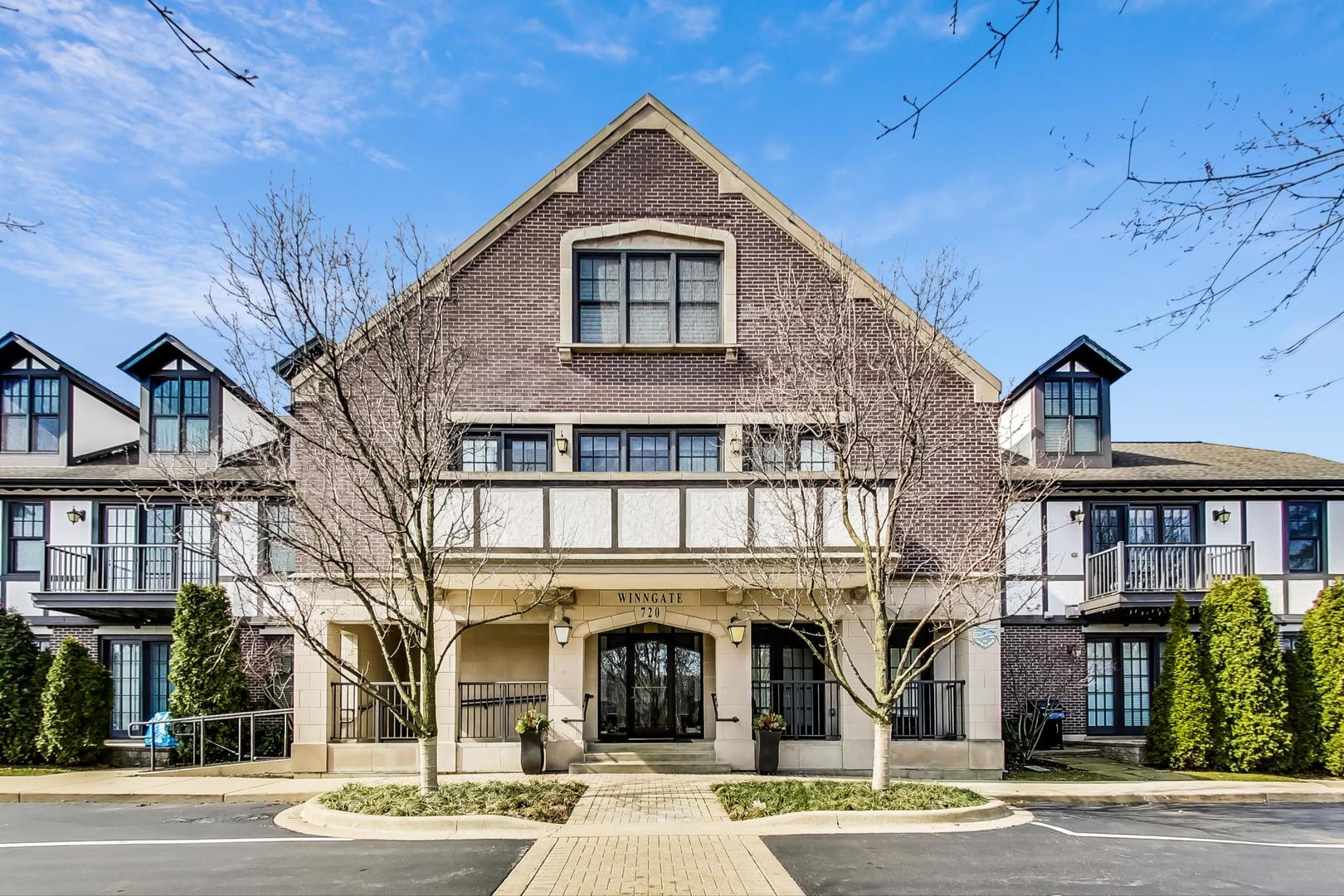 720 Green Bay Road, Unit 2D Winnetka, IL 60093 - Photo 1 of 41 a front view of a house with a yard