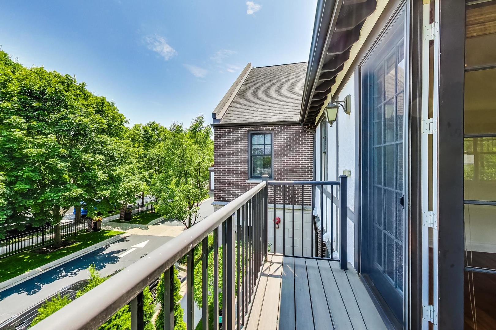 720 Green Bay Road, Unit 2D Winnetka, IL 60093 - Photo 12 of 41 a view of a balcony with wooden floor