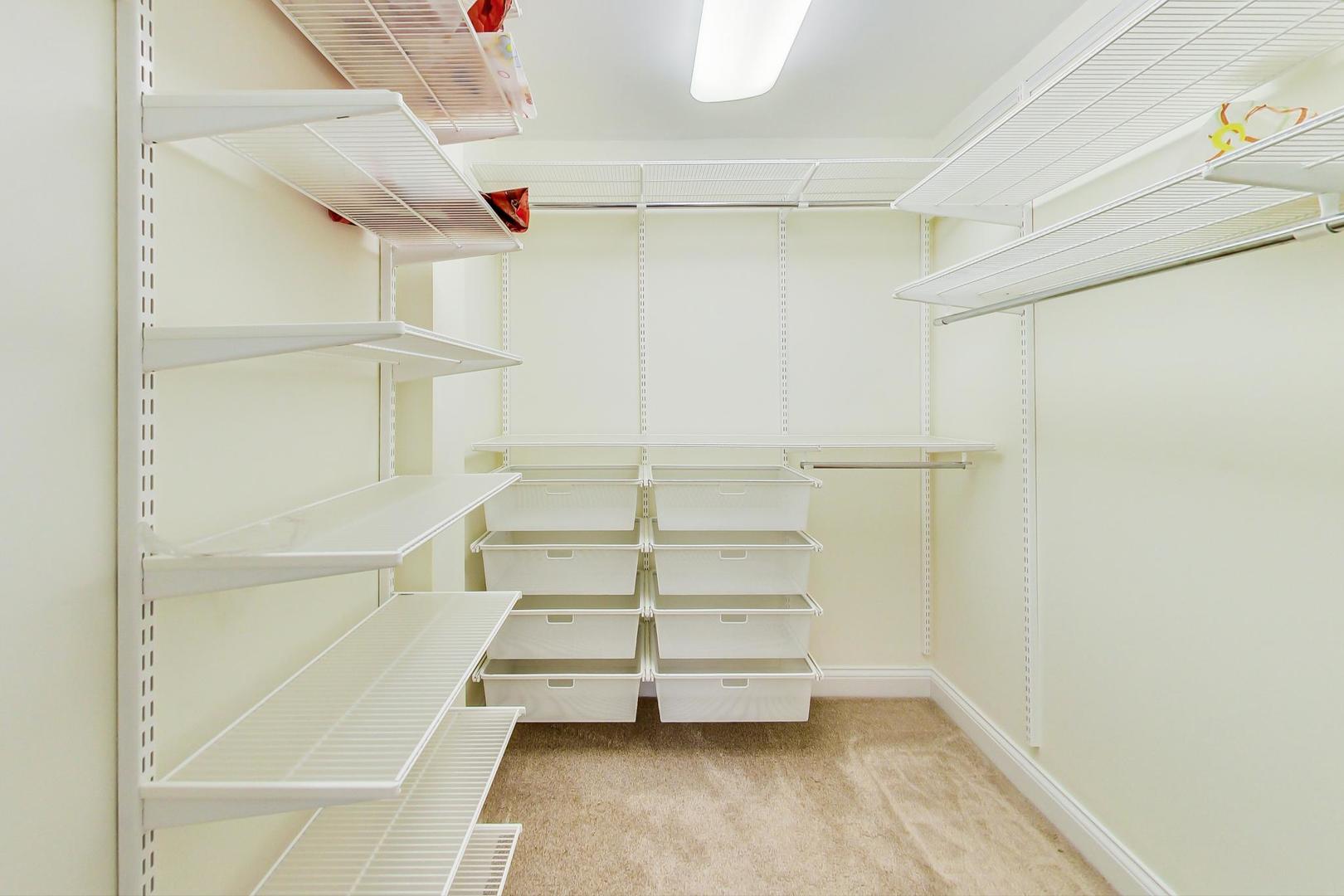 720 Green Bay Road, Unit 2D Winnetka, IL 60093 - Photo 18 of 41 a view of walk in closet with empty racks