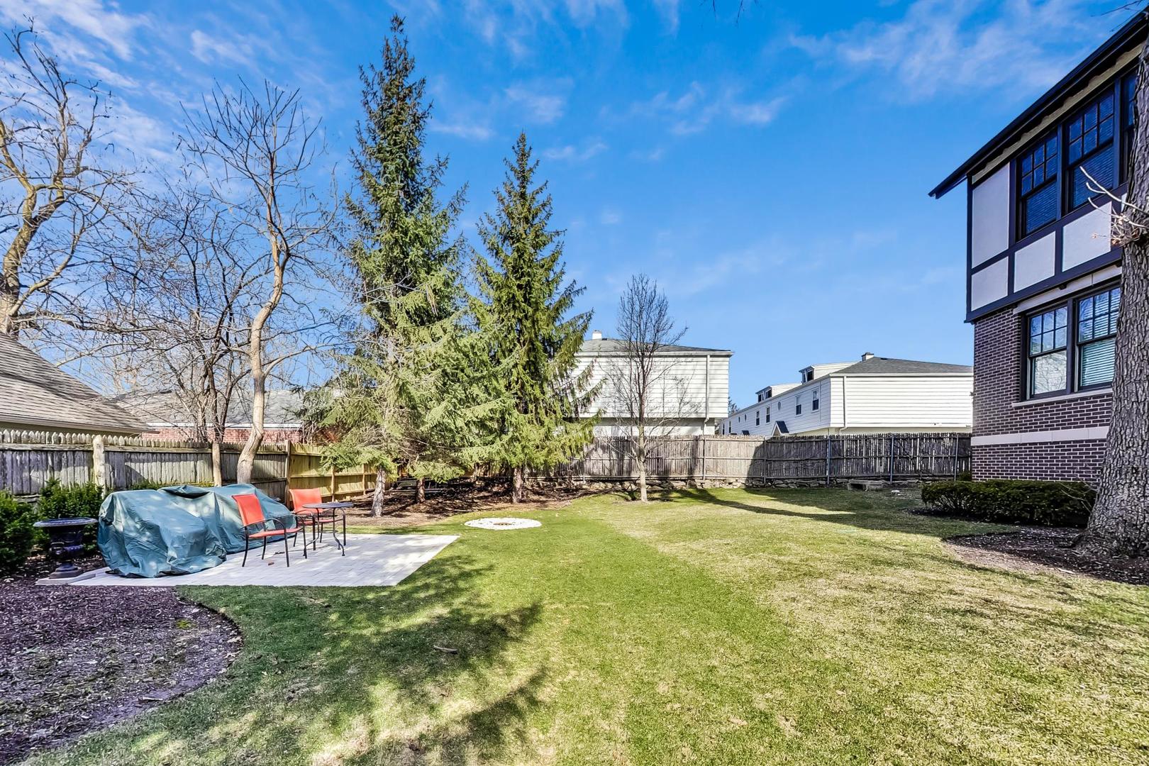 720 Green Bay Road, Unit 2D Winnetka, IL 60093 - Photo 36 of 41 a view of a house with a yard patio and fire pit