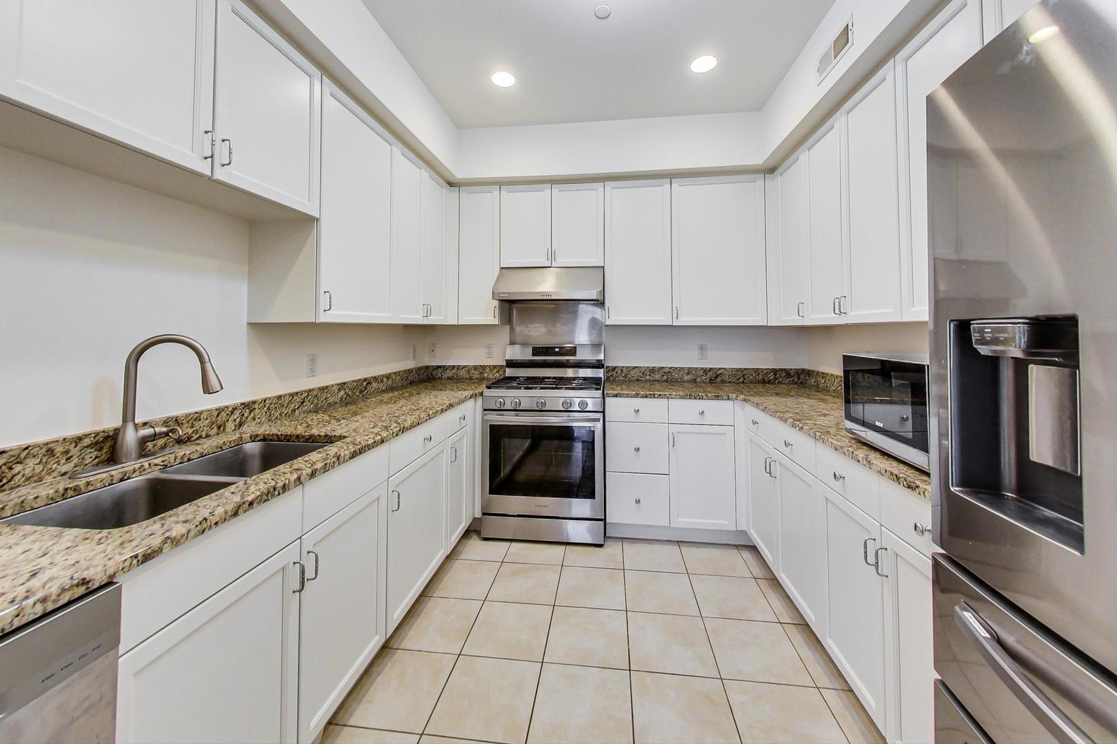 720 Green Bay Road, Unit 2D Winnetka, IL 60093 - Photo 8 of 41 a kitchen with cabinets a sink and appliances