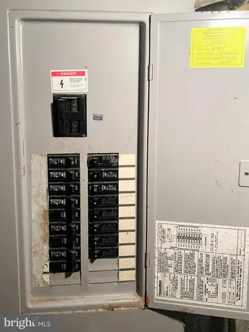 a view of a house with a yard balcony and a small park