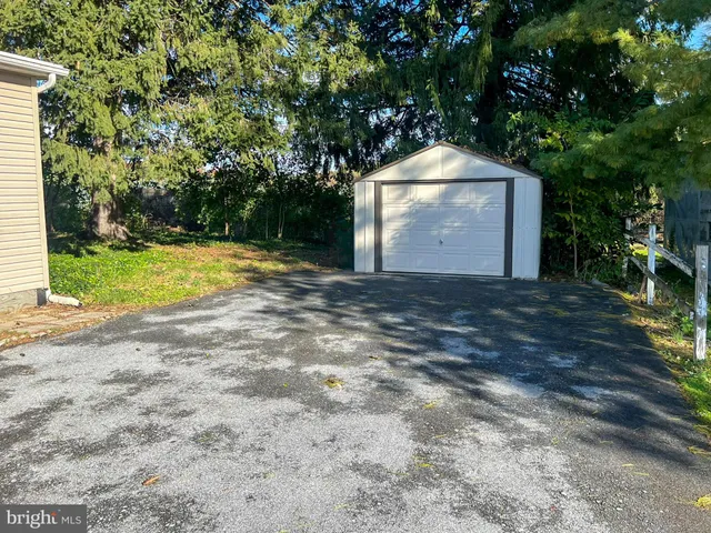a backyard of a house with portable swimming pool and outdoor seating