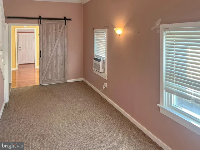 a view of a hallway with windows