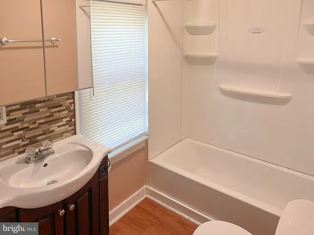 a bathroom with a sink and a bathtub