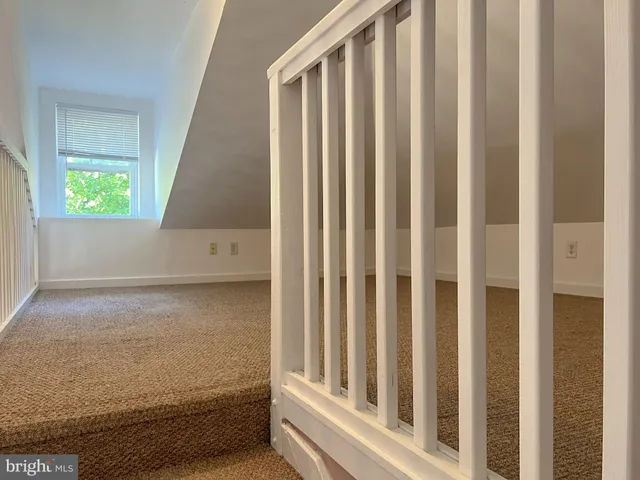 a view of a porch with wooden floor and stairs