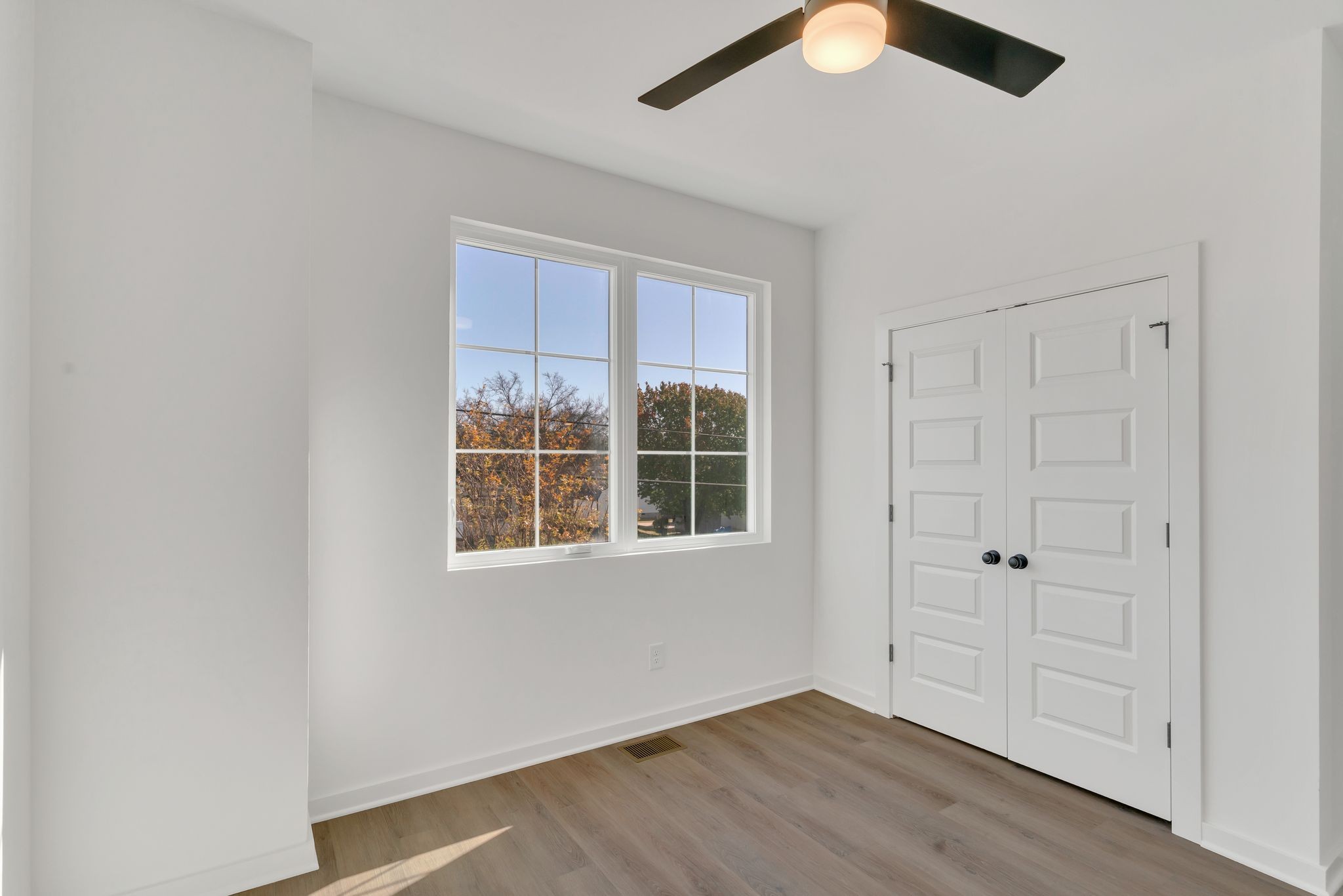 308 Cedar Street, Unit 2 Lebanon, TN 37087 - Photo 15 of 28 an empty room with wooden floor closet and windows