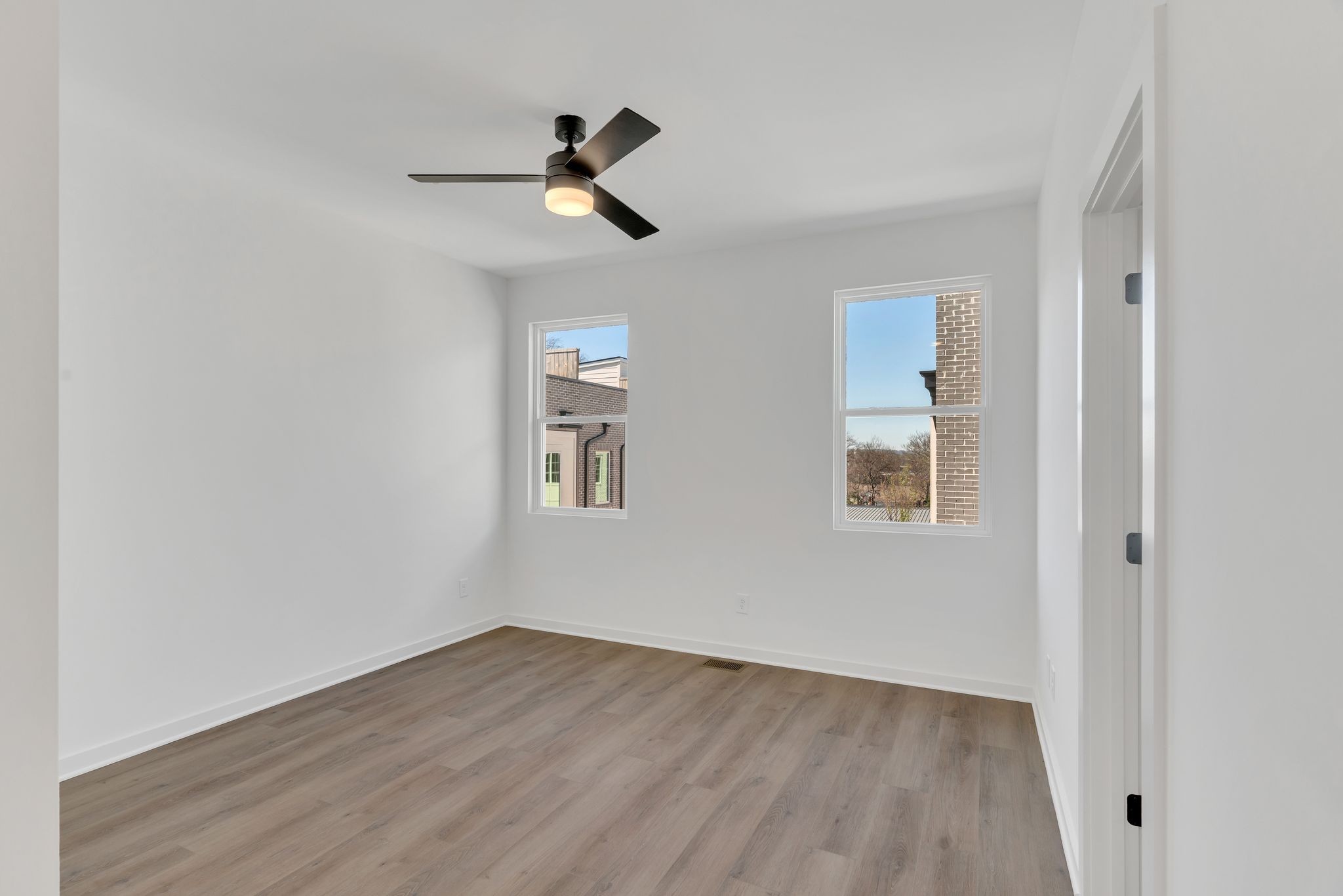 308 Cedar Street, Unit 2 Lebanon, TN 37087 - Photo 16 of 28 a view of empty room with wooden floor and fan