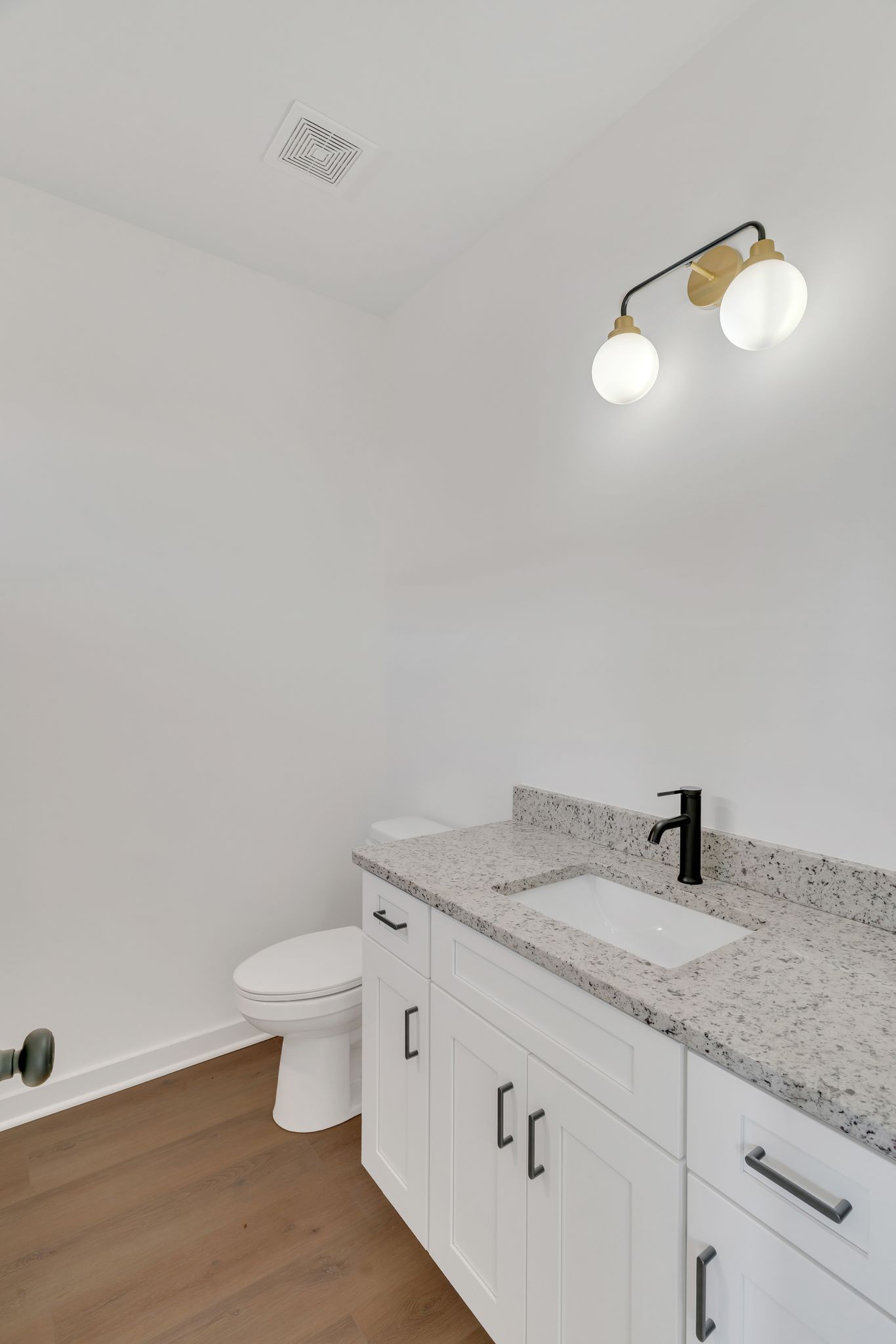 308 Cedar Street, Unit 2 Lebanon, TN 37087 - Photo 18 of 28 a bathroom with a granite countertop sink and a toilet