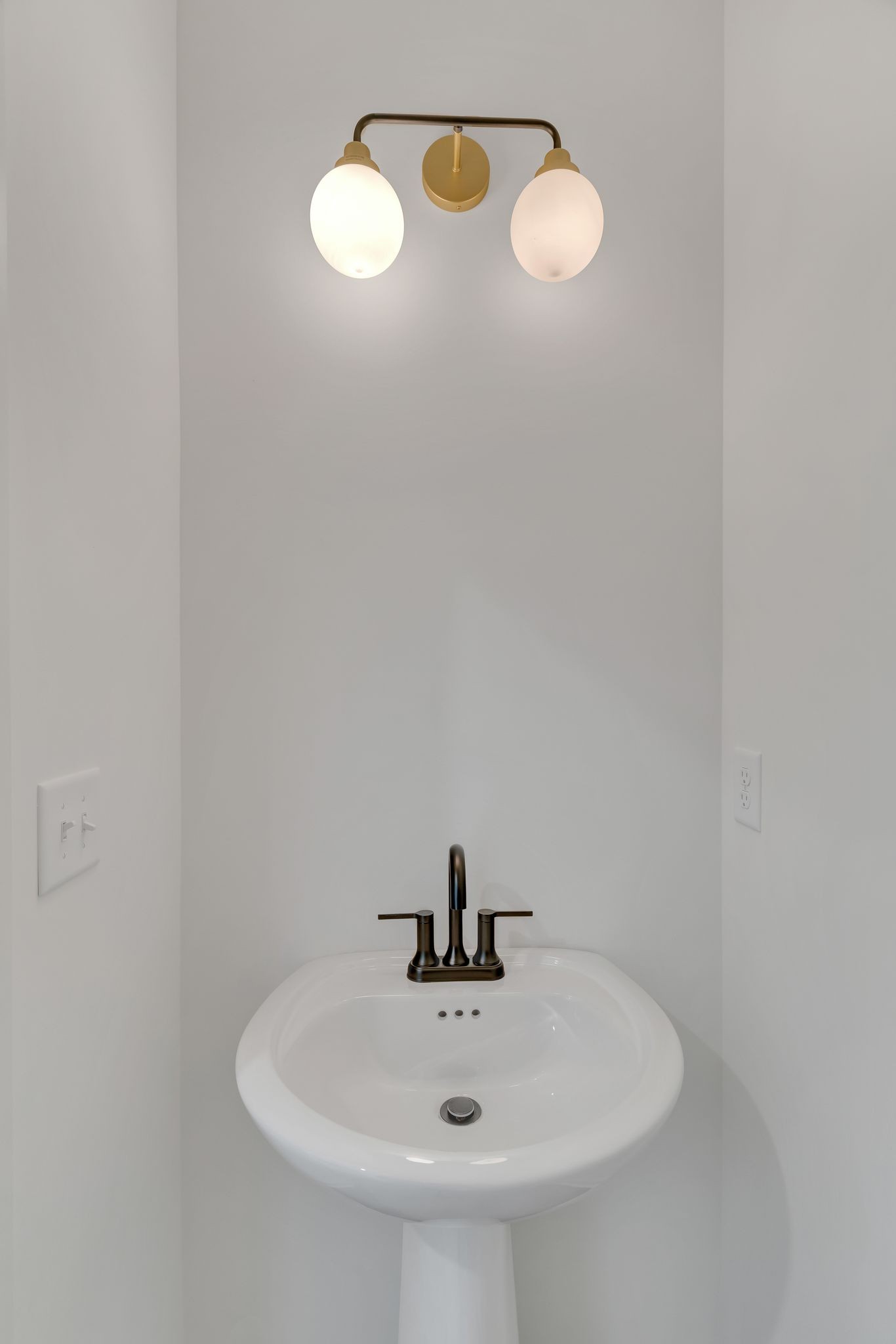 308 Cedar Street, Unit 2 Lebanon, TN 37087 - Photo 22 of 28 a bathroom with a sink and mirror