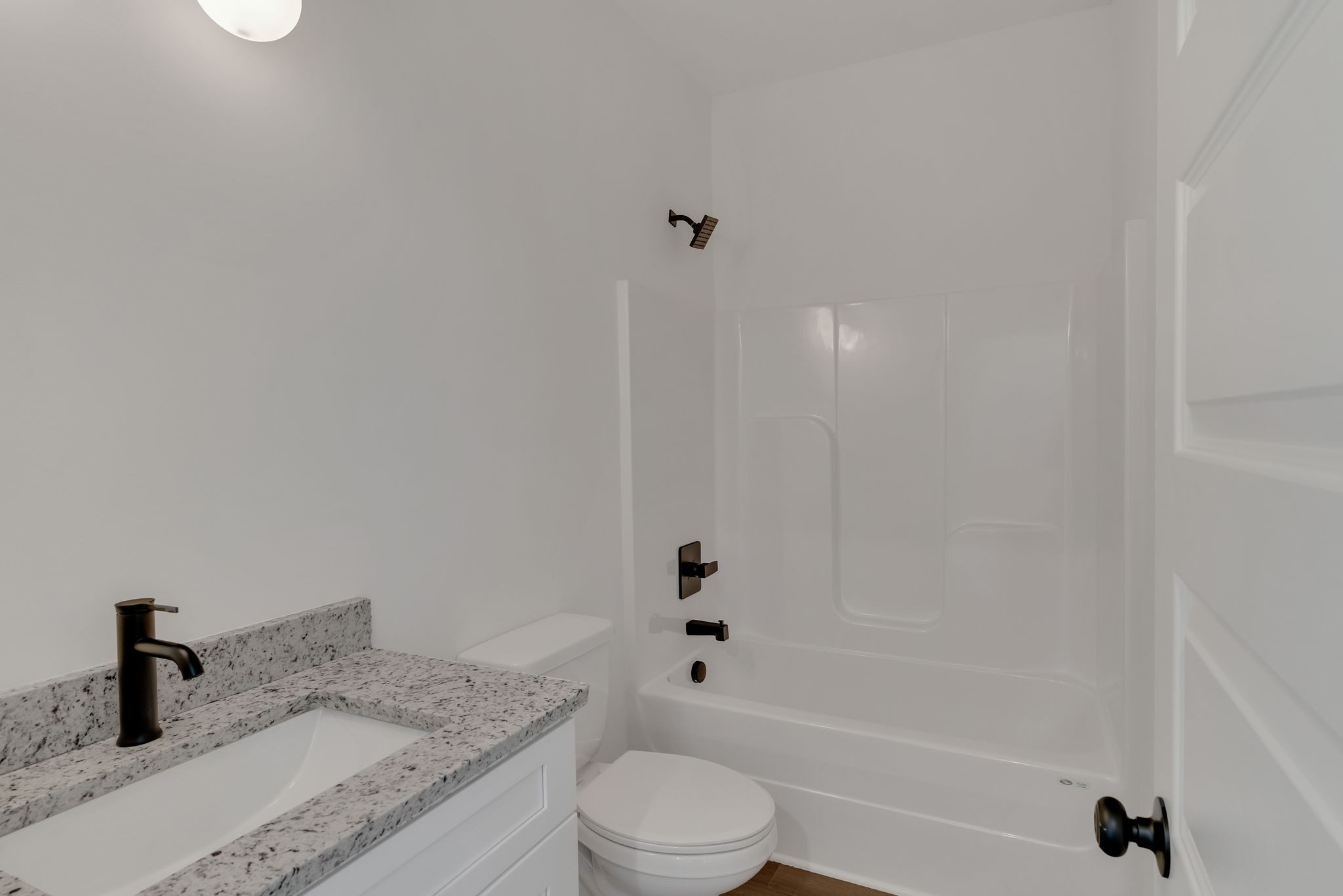 308 Cedar Street, Unit 2 Lebanon, TN 37087 - Photo 25 of 28 a bathroom with a granite countertop sink toilet and shower