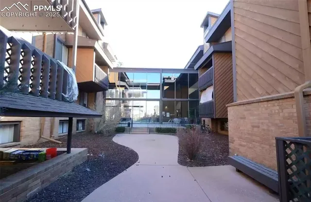 a view of balcony with furniture
