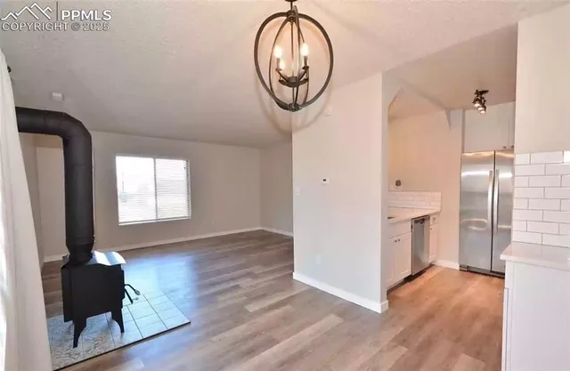 a very nice looking room with many windows and a fireplace