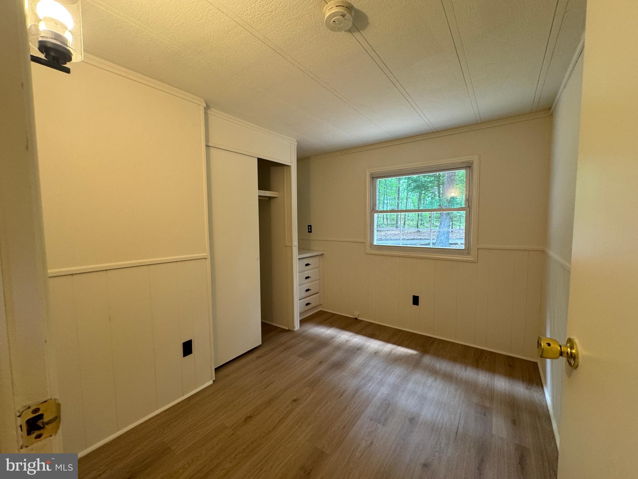 9216 Lawyers Road Spotsylvania, VA 22551 - Photo 12 of 19 a view of empty room with wooden floor