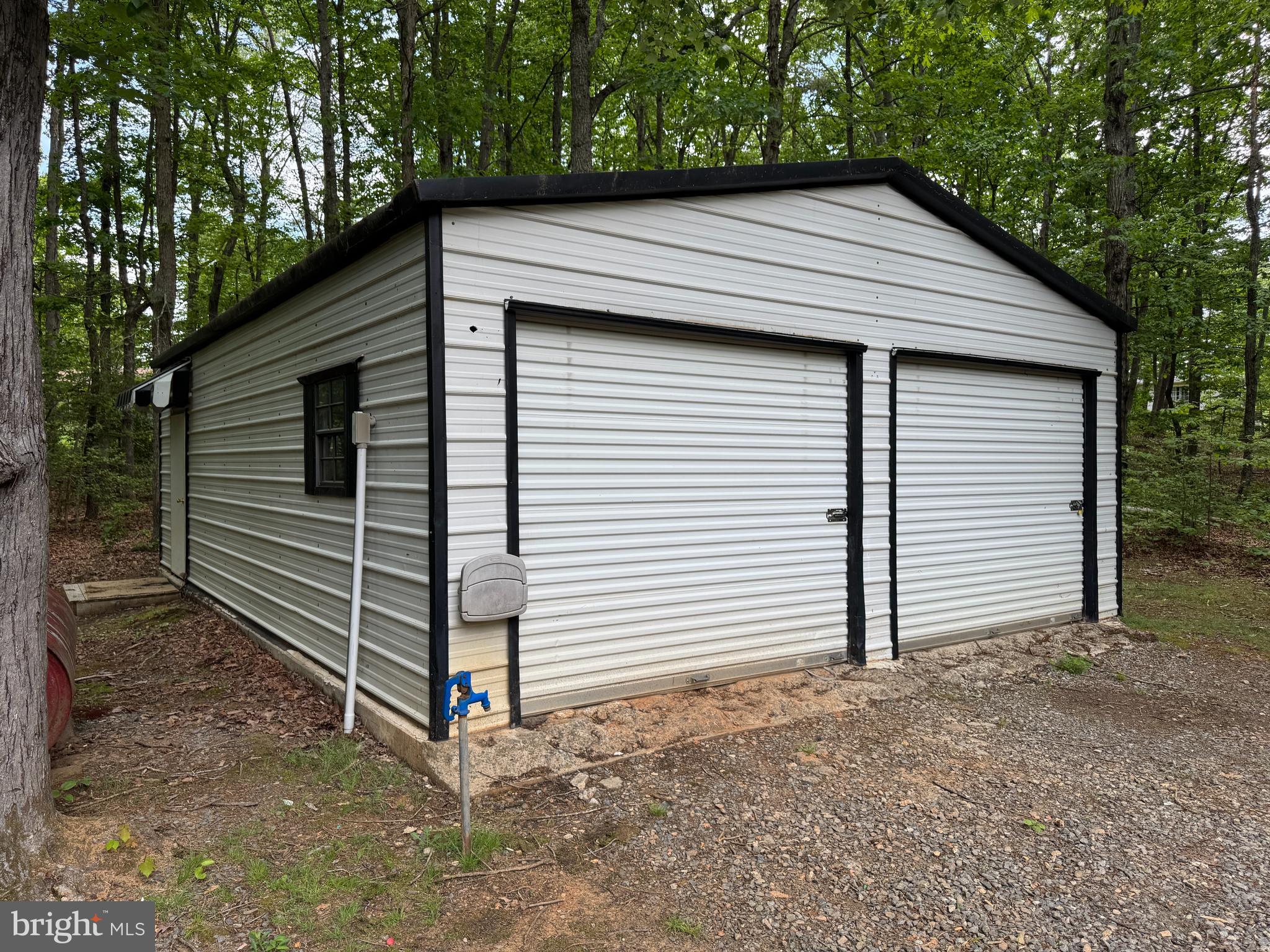 9216 Lawyers Road Spotsylvania, VA 22551 - Photo 17 of 19 a view of a house with a yard and garage