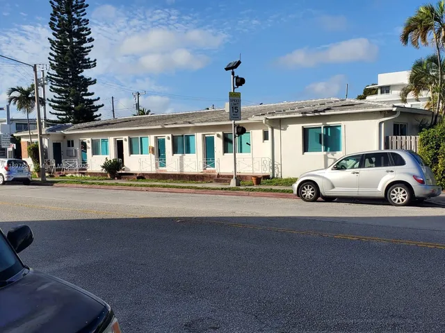 a view of a car parked in front of a building