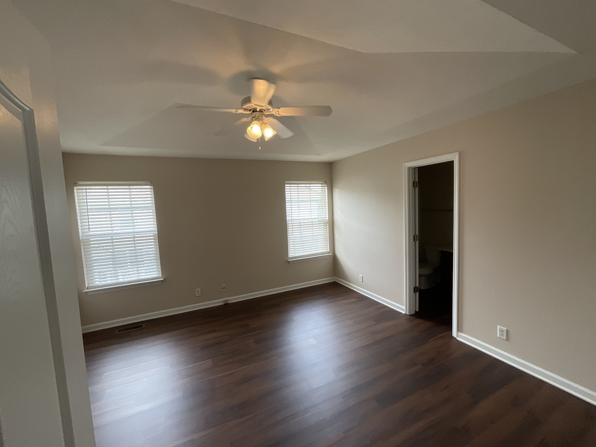 304 Shoshone Place Murfreesboro, TN 37128 - Photo 15 of 29 an empty room with wooden floor and windows