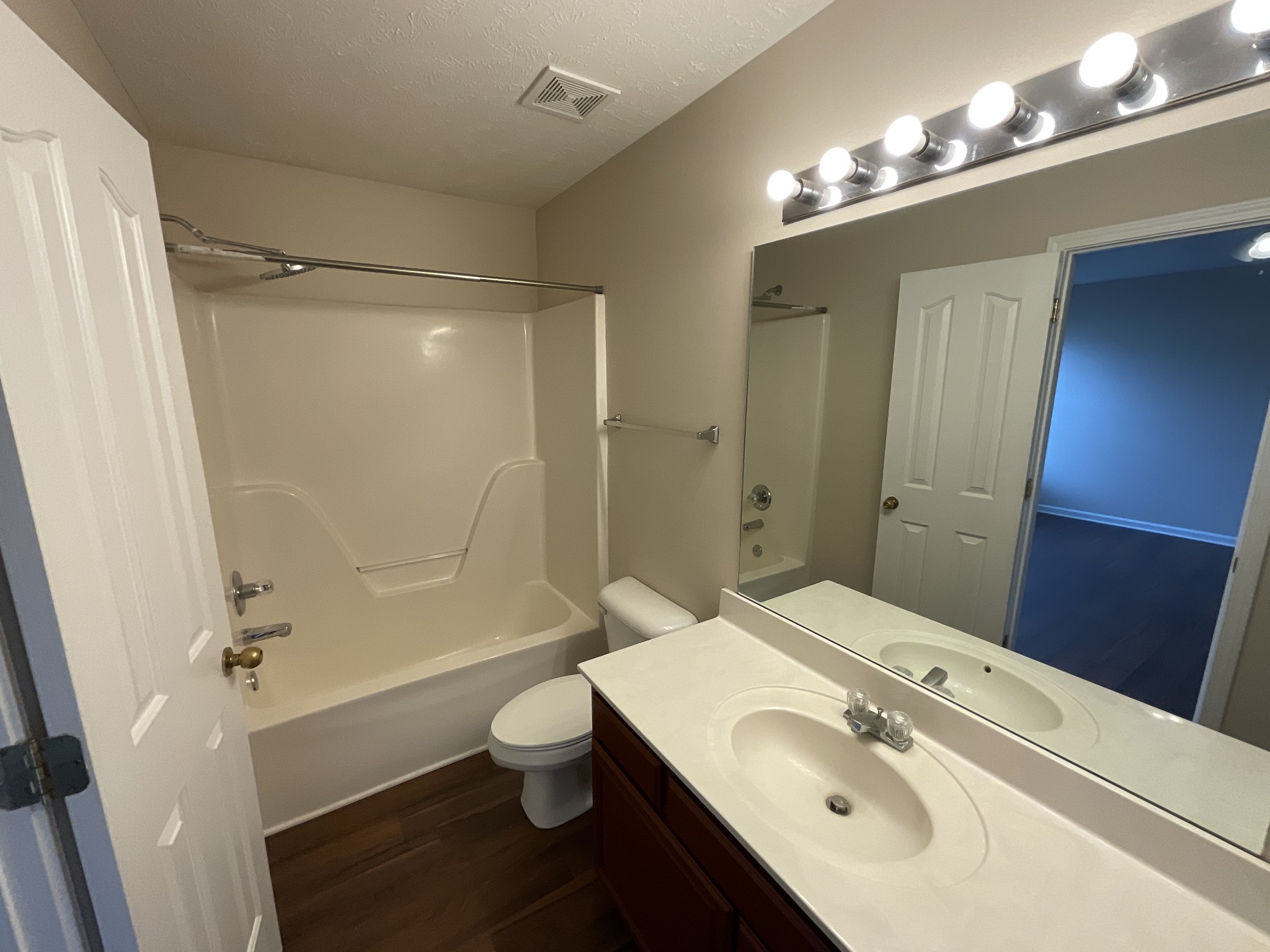304 Shoshone Place Murfreesboro, TN 37128 - Photo 16 of 29 a bathroom with a sink a toilet a mirror and shower