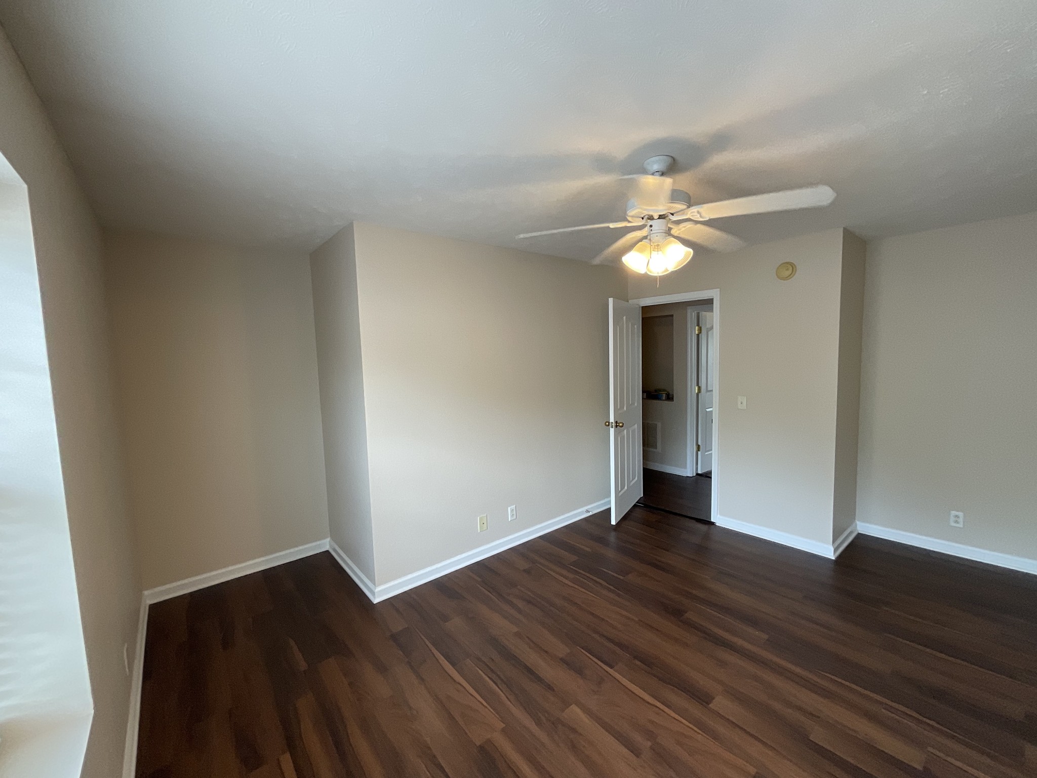 304 Shoshone Place Murfreesboro, TN 37128 - Photo 20 of 29 an empty room with wooden floor and windows