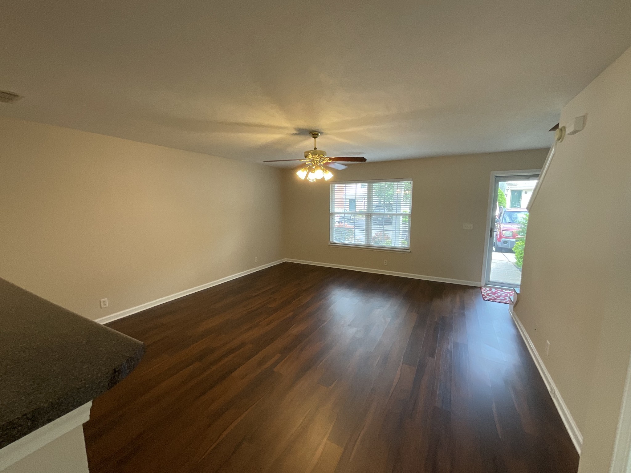 304 Shoshone Place Murfreesboro, TN 37128 - Photo 4 of 29 an empty room with wooden floor and windows